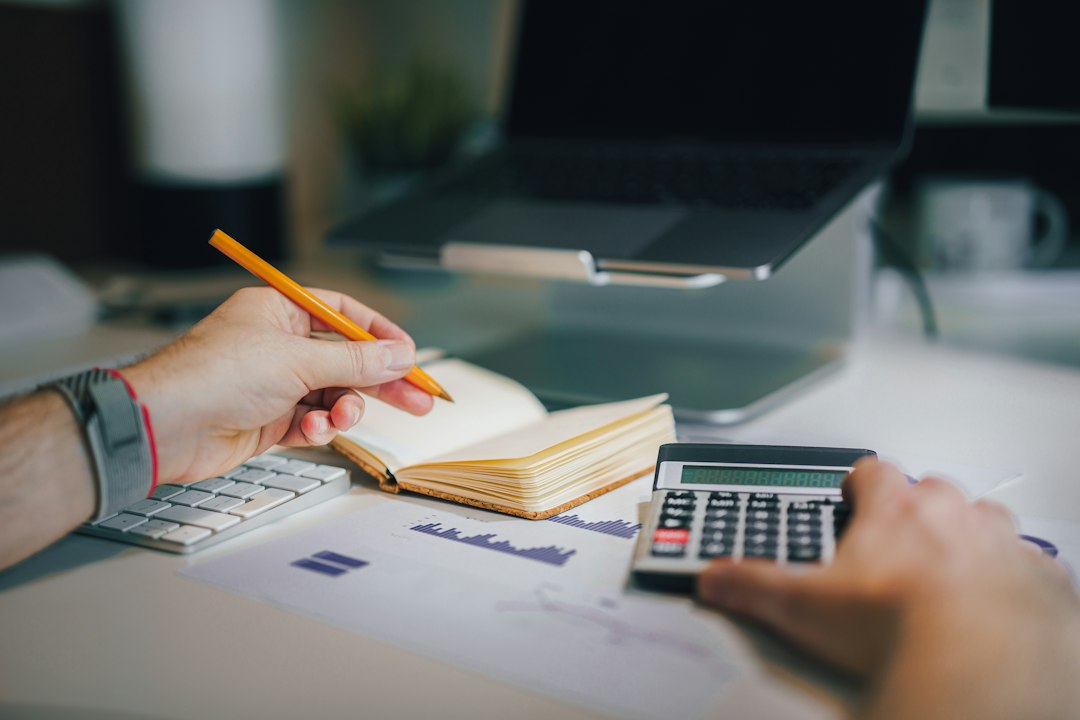 Financial planning desk with calculator and cash-flow analysis representing the working capital required as Sellvia order volume grows